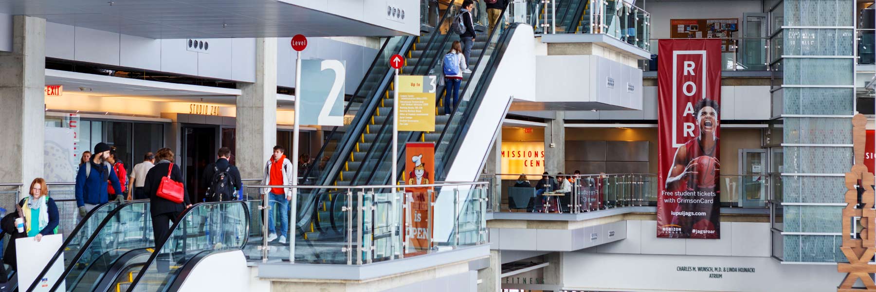 People walking on the second floor of the campus center.