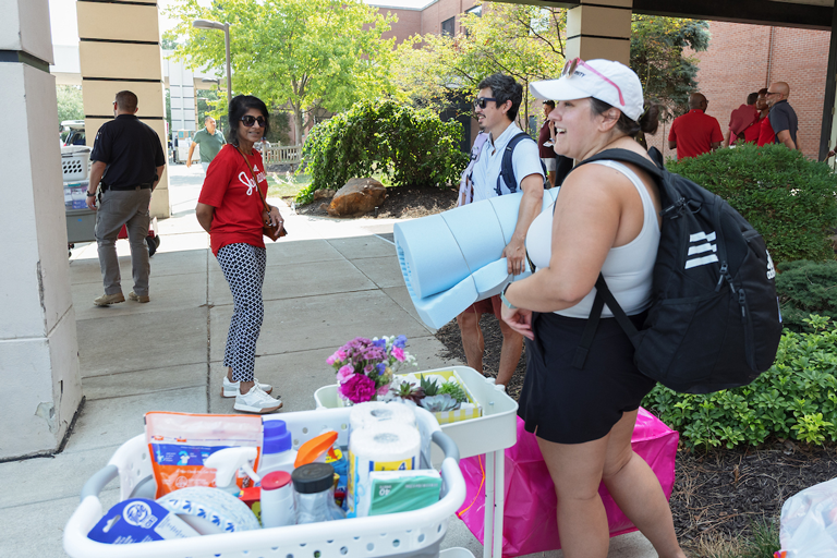 Chancellor Ramchand with students that are moving in.