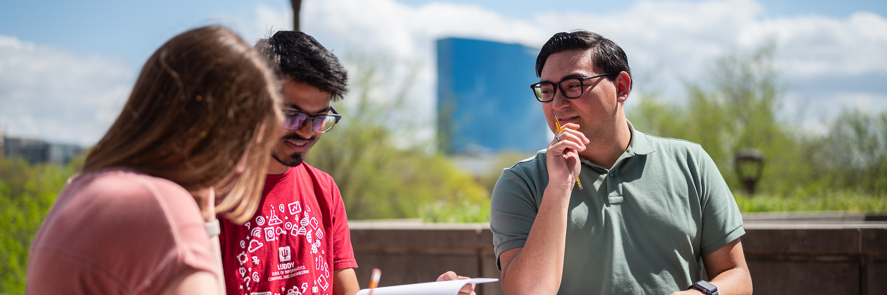 A group of students sitting and smiling.